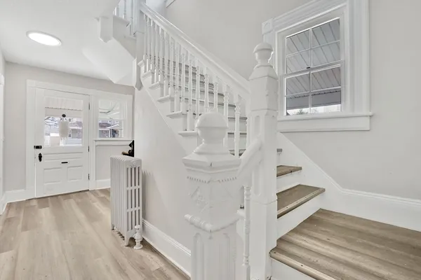 a view of entryway with wooden floor
