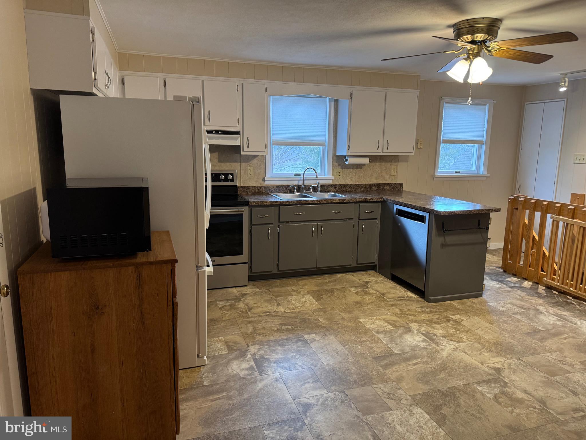 1009 Dry Wells Road Quarryville, PA 17566 - Photo 7 of 17 a kitchen with stainless steel appliances granite countertop a refrigerator oven a sink dishwasher and a refrigerator