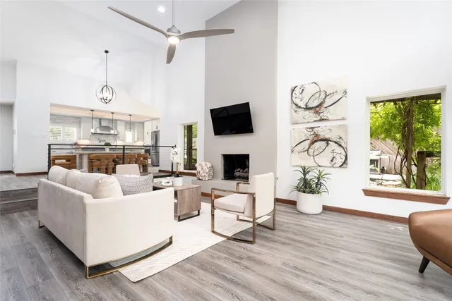 a living room with fireplace furniture and a flat screen tv