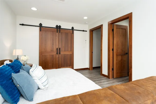 a bedroom with a bed and a walk in closet