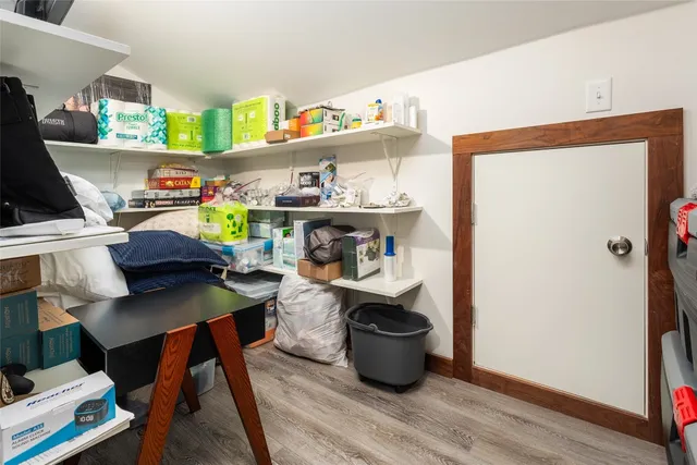 a workspace with furniture and wooden floor