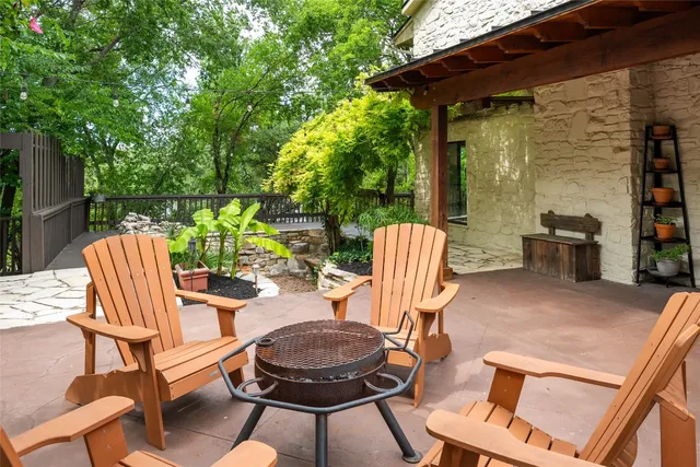 a view of an outdoor sitting area with furniture and wooden floor