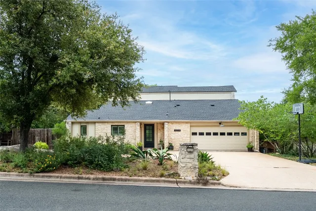 a front view of a building with garden