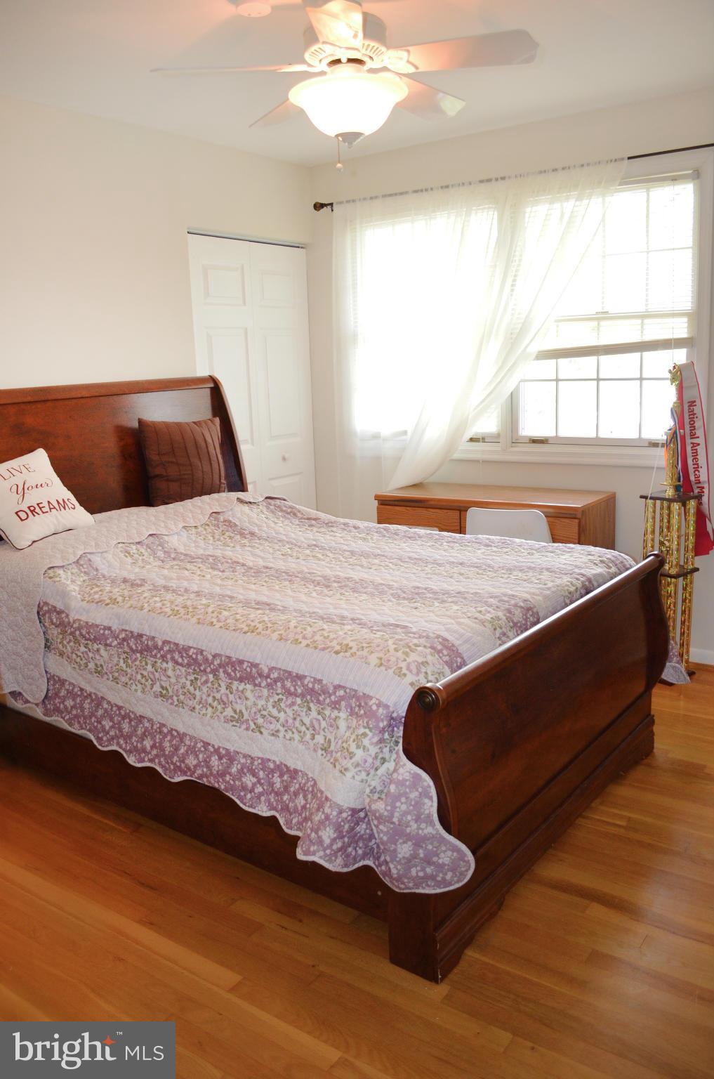 5534 Callander Drive Springfield, VA 22151 - Photo 12 of 20 a bedroom with a bed and window