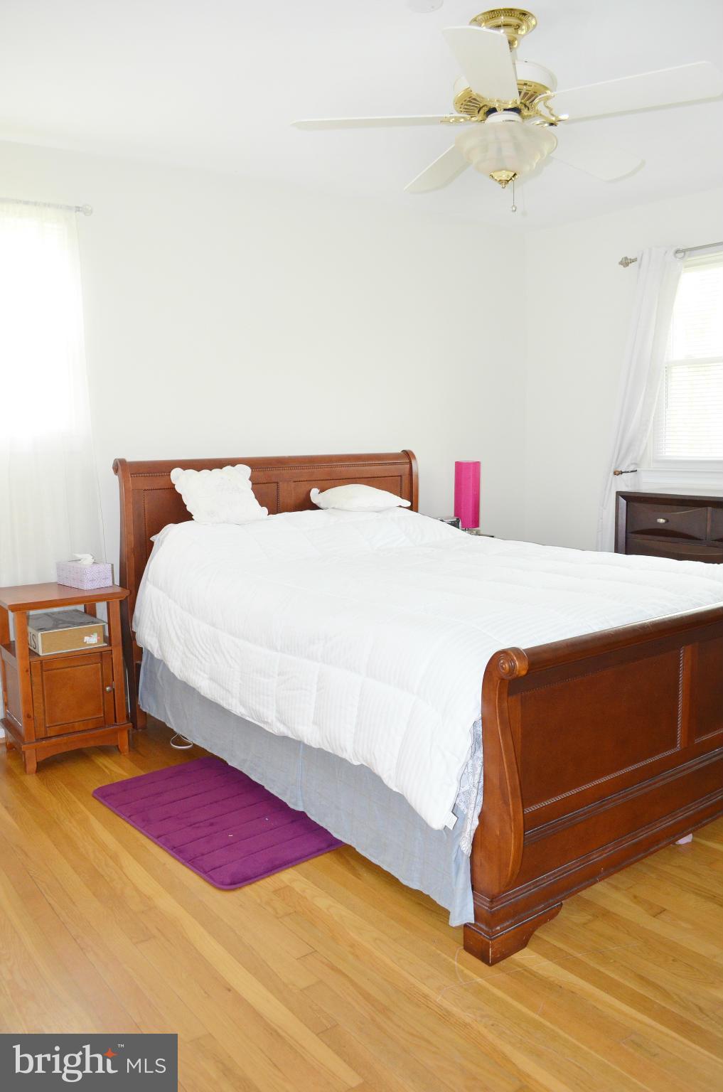 5534 Callander Drive Springfield, VA 22151 - Photo 10 of 20 a bedroom with a bed and a chandelier