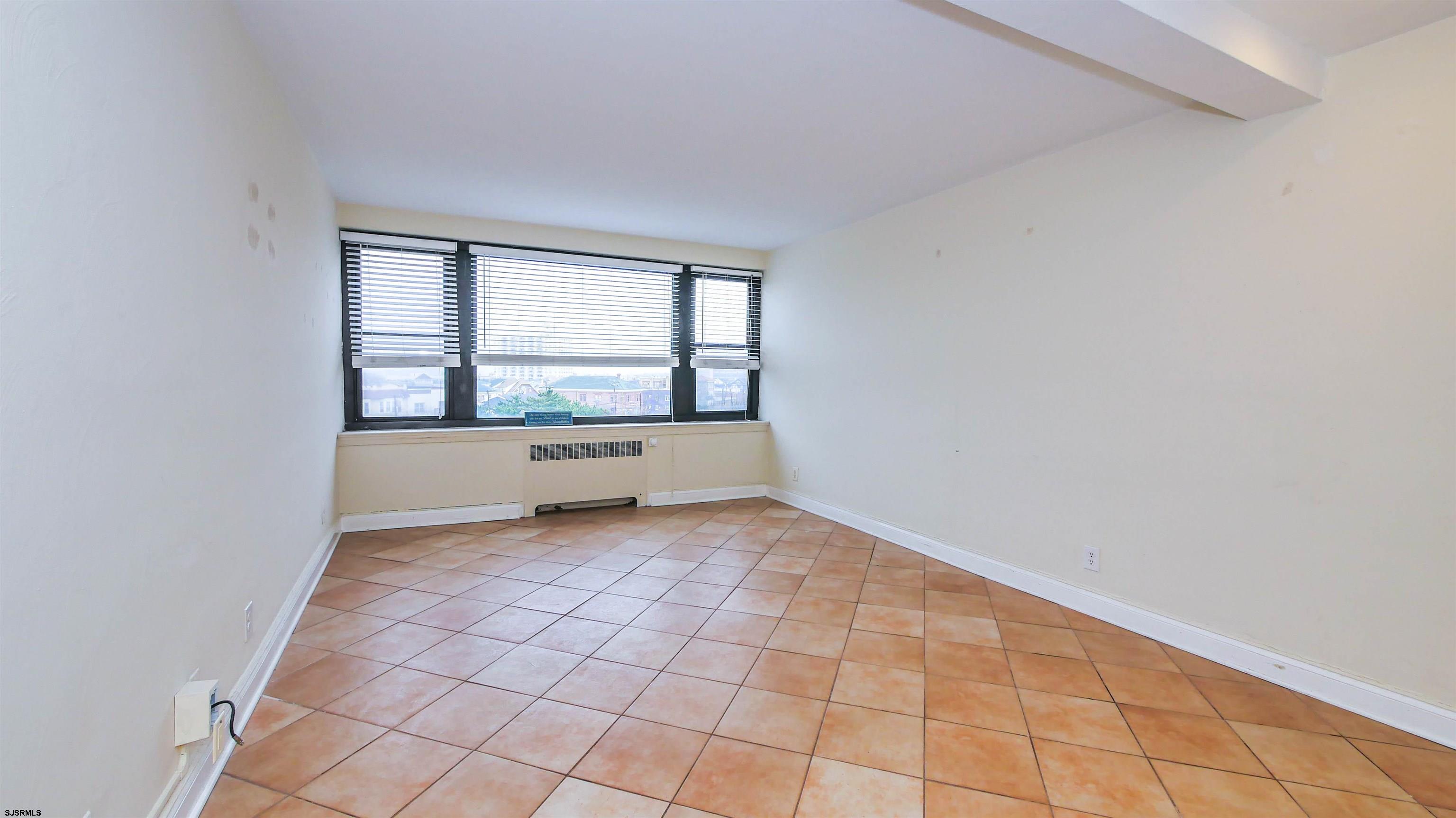 101 South Raleigh Avenue, Unit 521 Atlantic City, NJ 08401 - Photo 13 of 27 an empty room with windows