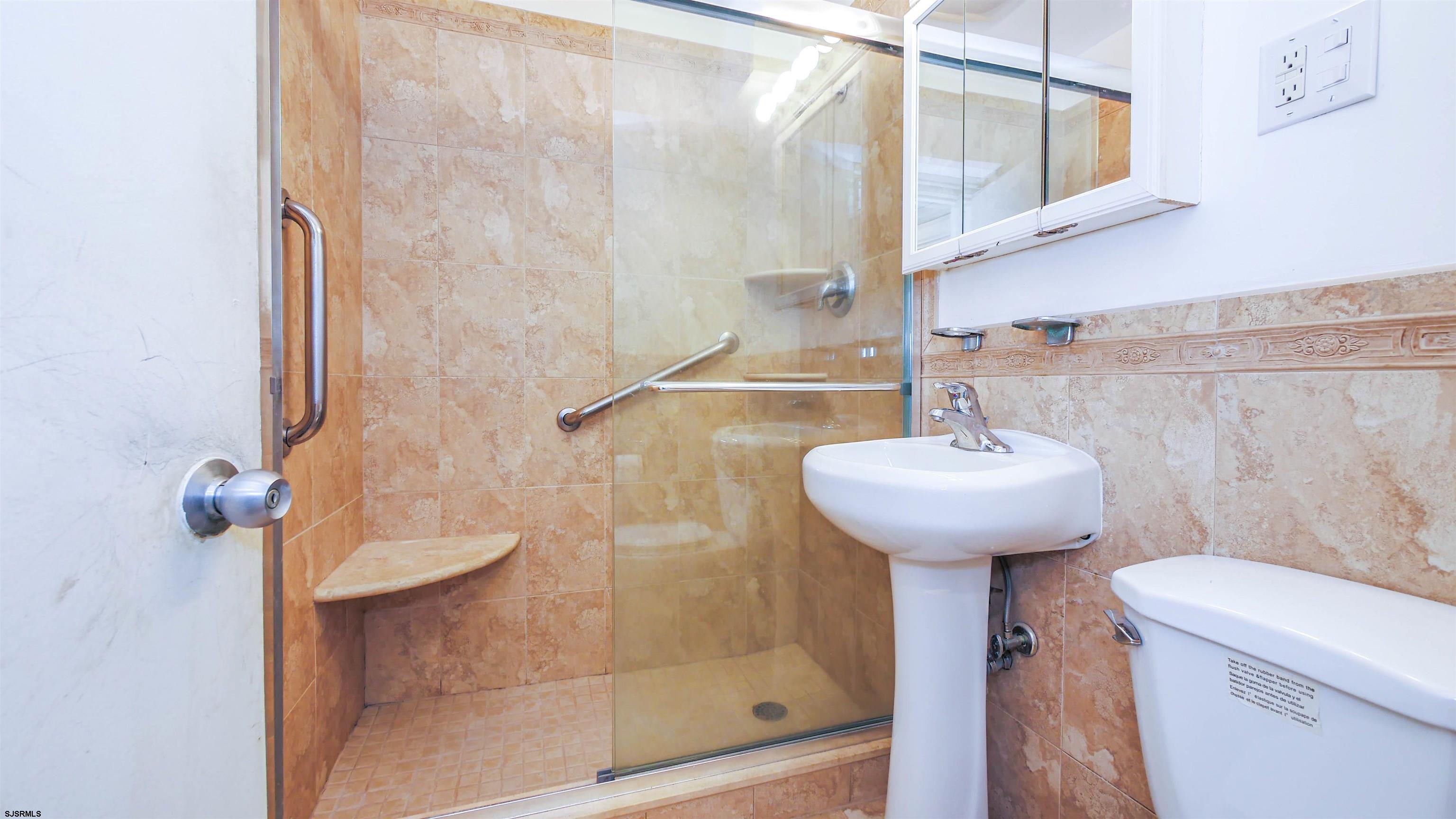 101 South Raleigh Avenue, Unit 521 Atlantic City, NJ 08401 - Photo 17 of 27 a bathroom with a sink a toilet and shower