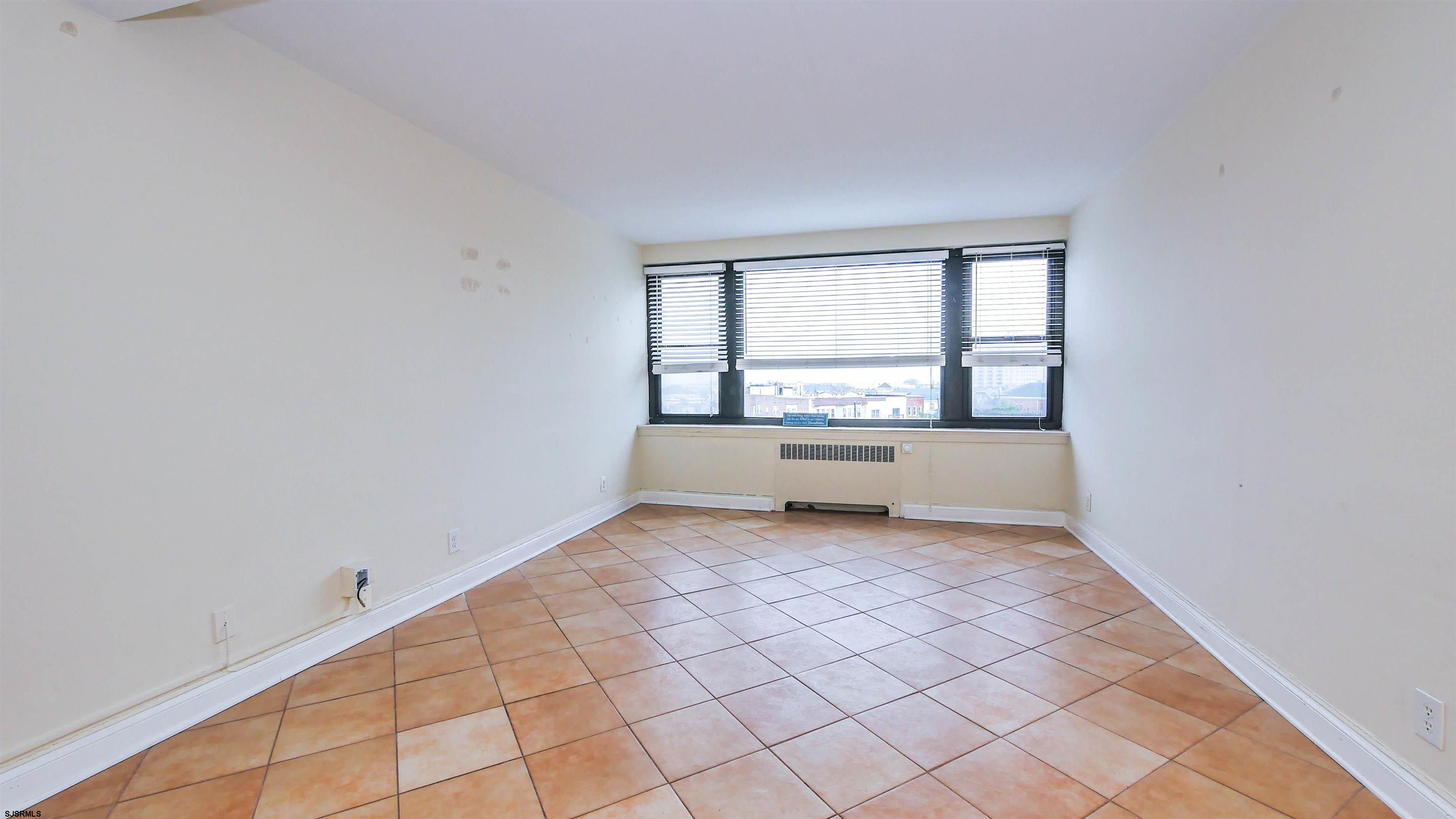 101 South Raleigh Avenue, Unit 521 Atlantic City, NJ 08401 - Photo 9 of 27 a view of an empty room with a window