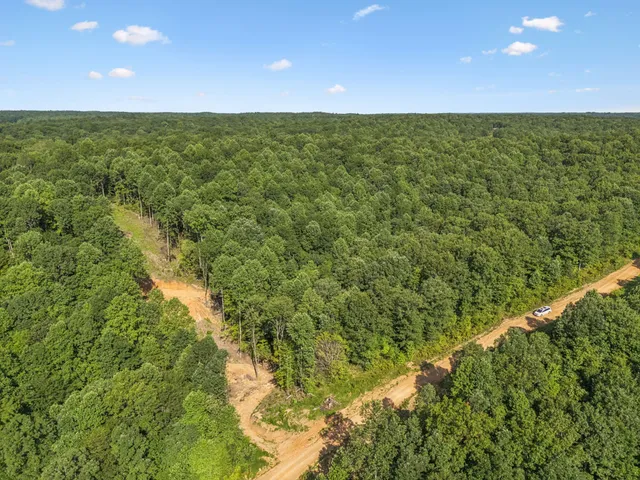 a view of a field with an outdoor space