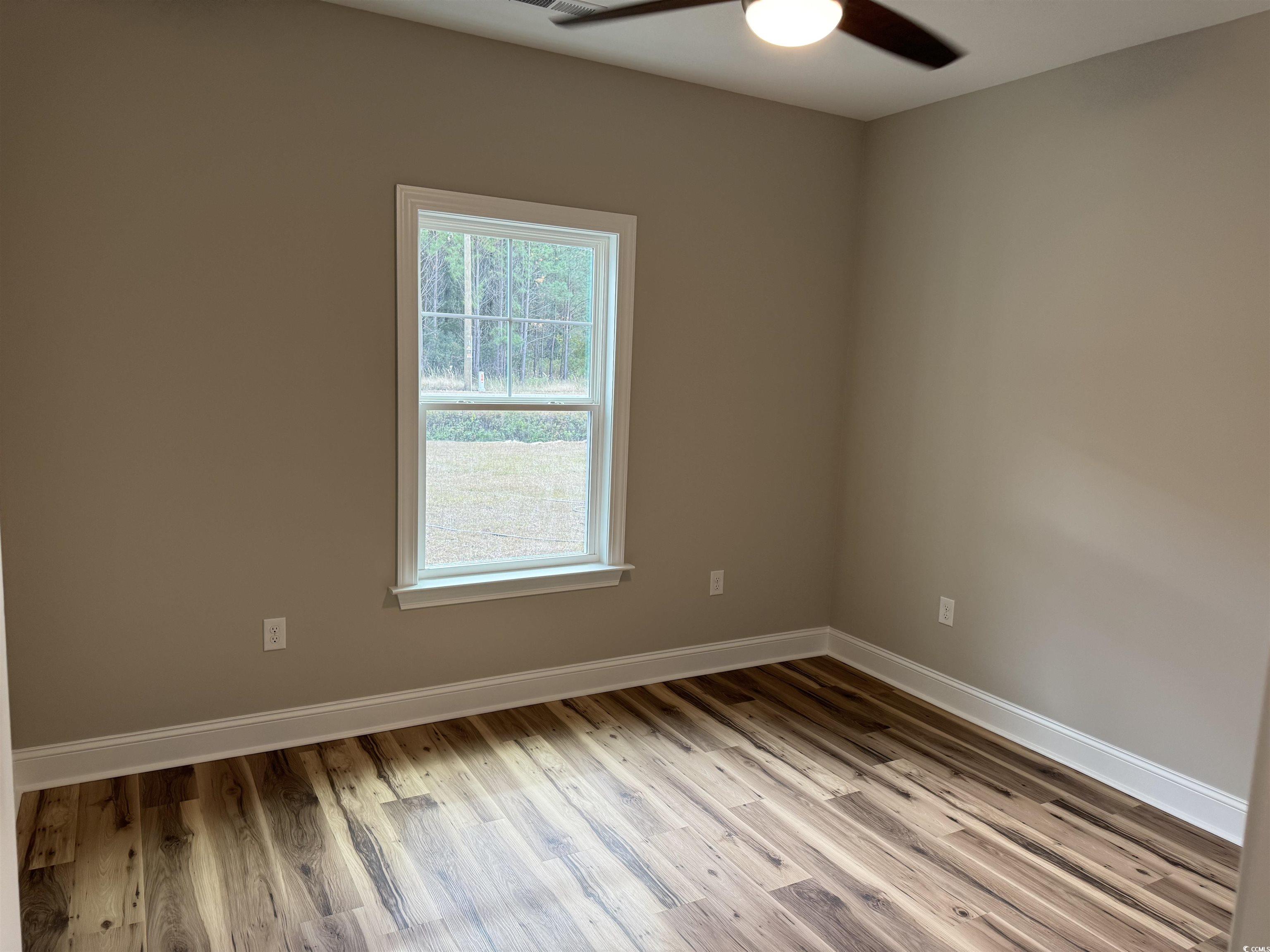 4963 Dupont Road Aynor, SC 29511 - Photo 14 of 18 Spare room featuring light wood-style flooring and a ceiling fan