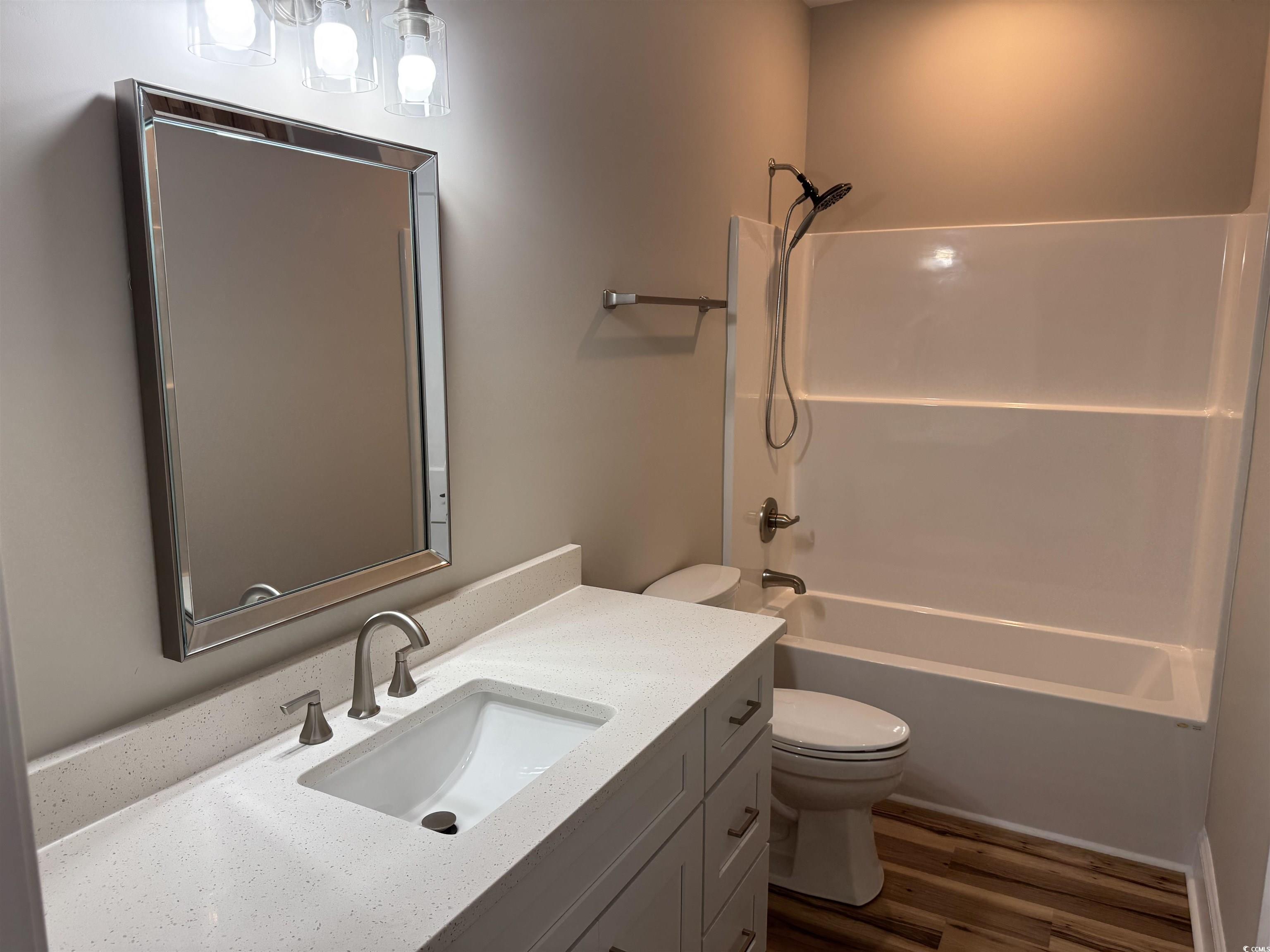 4963 Dupont Road Aynor, SC 29511 - Photo 15 of 18 Bathroom with vanity, shower / tub combination, and dark wood-style floors