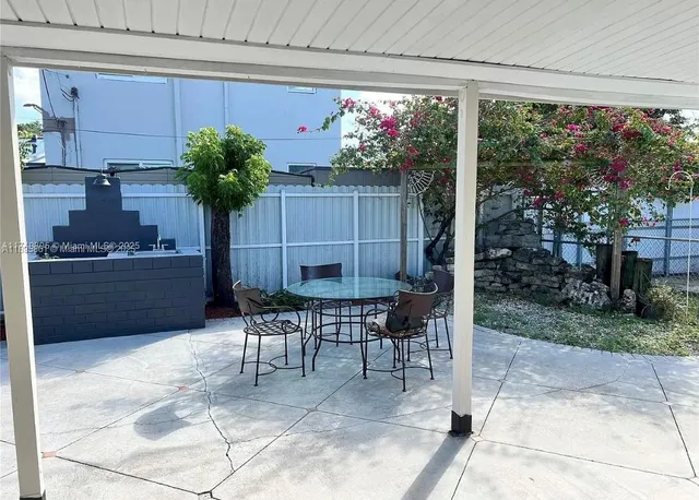 a wooden bench sitting in front of a building