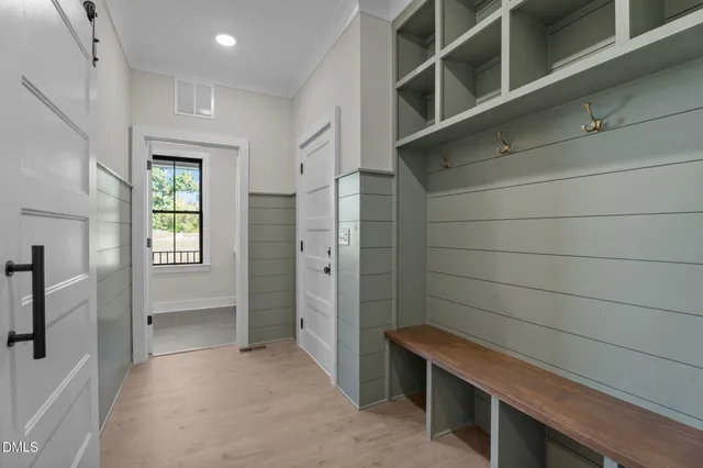 a view of a big room with wooden floor and closet area