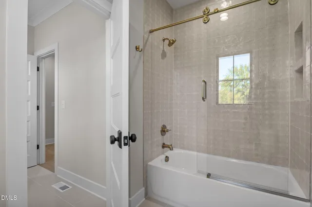 a bathroom with a sink toilet vanity and shower