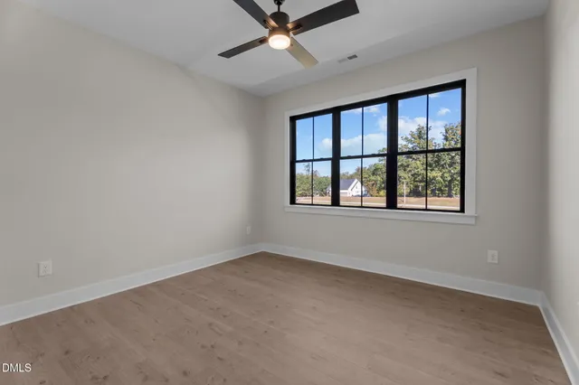 a view of house with backyard