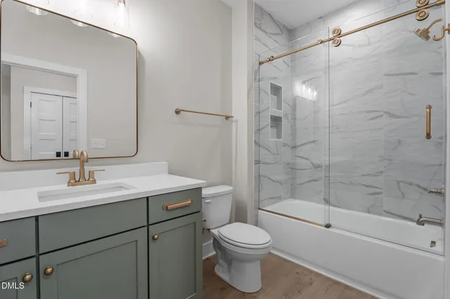 a view of the house with backyard and trees