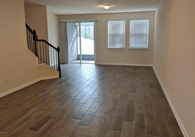 a kitchen with sink and mirror