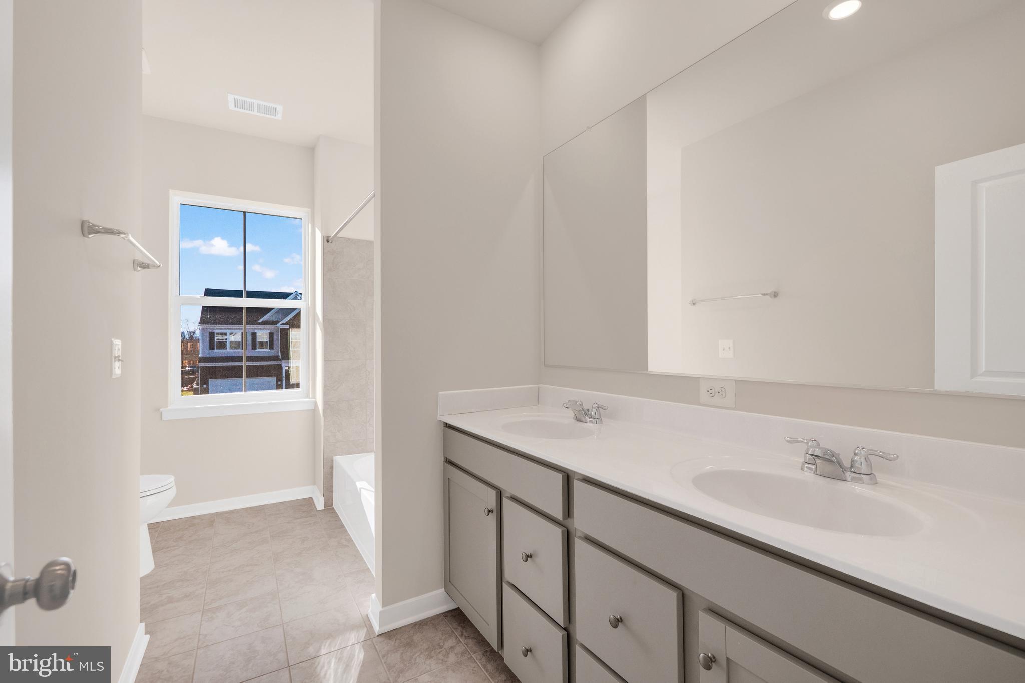 493 Mountain Laurel Boulevard Ranson, WV 25438 - Photo 15 of 27 a bathroom with a sink and a