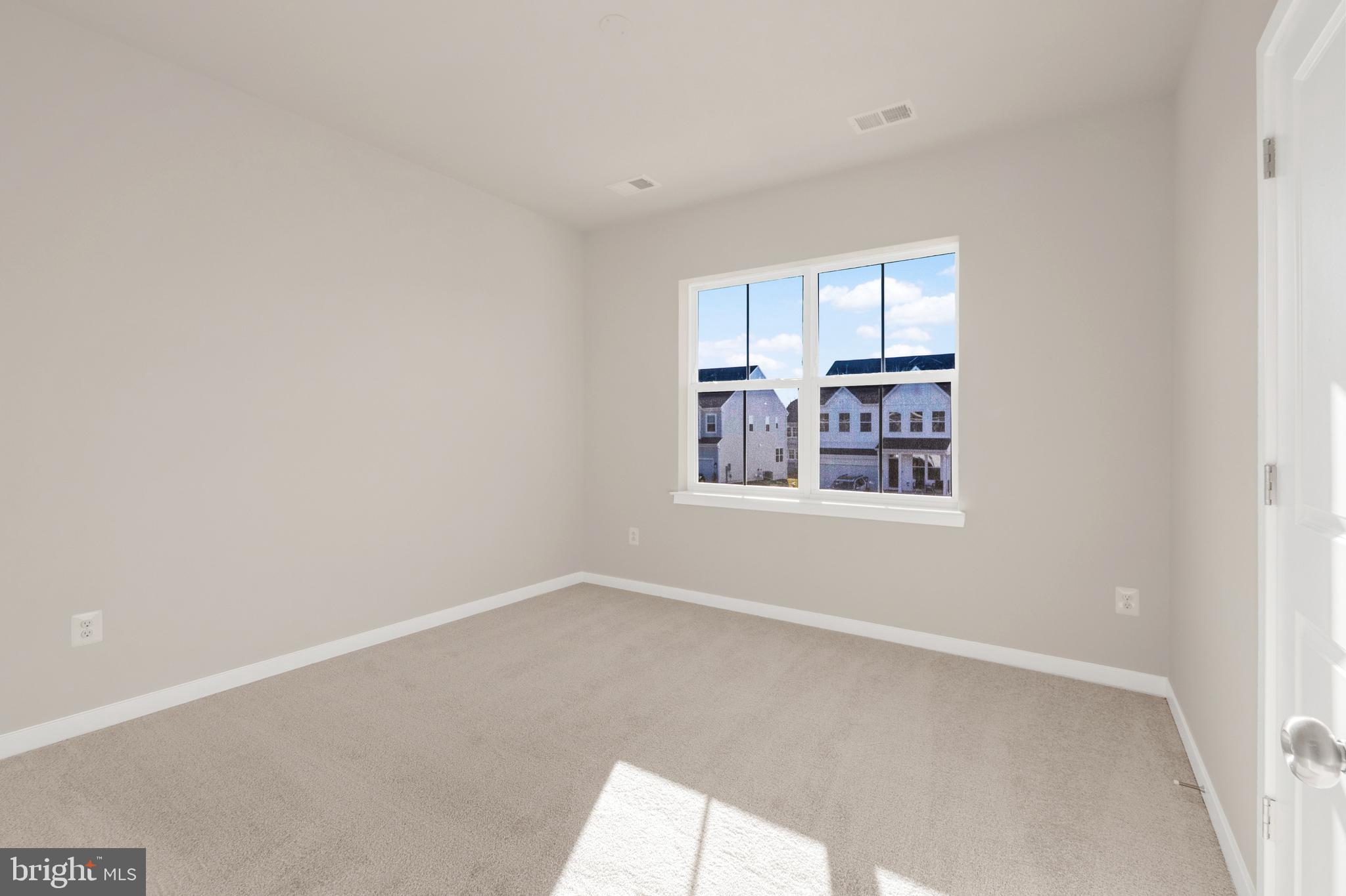 493 Mountain Laurel Boulevard Ranson, WV 25438 - Photo 17 of 27 an empty room with windows
