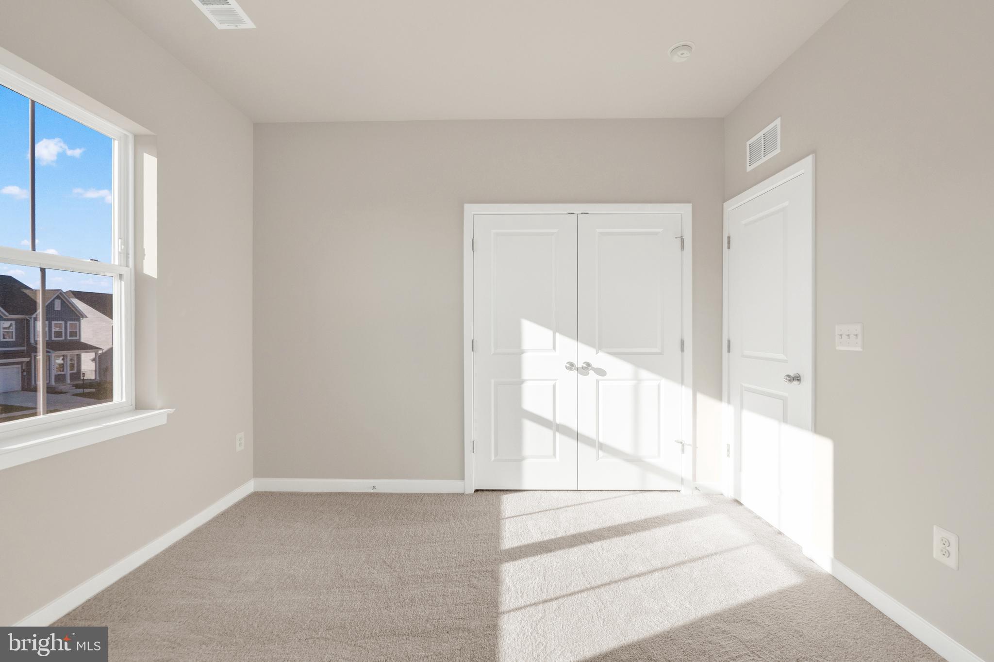 493 Mountain Laurel Boulevard Ranson, WV 25438 - Photo 18 of 27 a view of staircase with white walls and windows