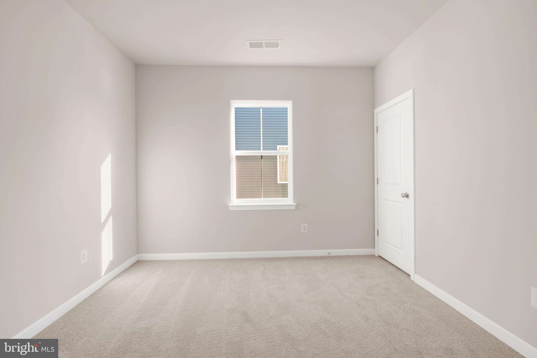 493 Mountain Laurel Boulevard Ranson, WV 25438 - Photo 19 of 27 an empty room with a window