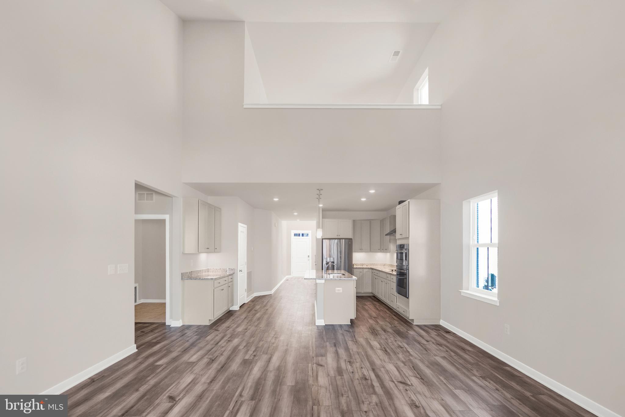493 Mountain Laurel Boulevard Ranson, WV 25438 - Photo 6 of 27 a view of a kitchen with a refrigerator and a window
