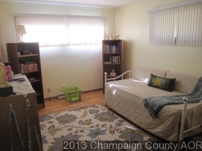 2332 Brookshire East Champaign, IL 61821 - Photo 12 of 15 a bed sitting in a bedroom next to a window