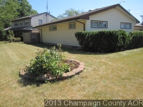2332 Brookshire East Champaign, IL 61821 - Photo 3 of 15 a front view of a house with a garden