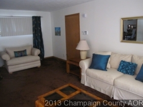 2332 Brookshire East Champaign, IL 61821 - Photo 5 of 15 a living room with furniture and a lamp