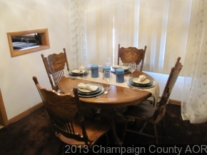 2332 Brookshire East Champaign, IL 61821 - Photo 6 of 15 a view of a dining room with furniture and wooden floor