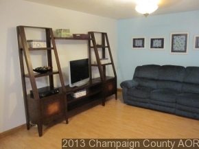 2332 Brookshire East Champaign, IL 61821 - Photo 8 of 15 a living room with furniture and a flat screen tv