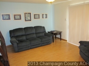 2332 Brookshire East Champaign, IL 61821 - Photo 9 of 15 a living room with furniture and a black door
