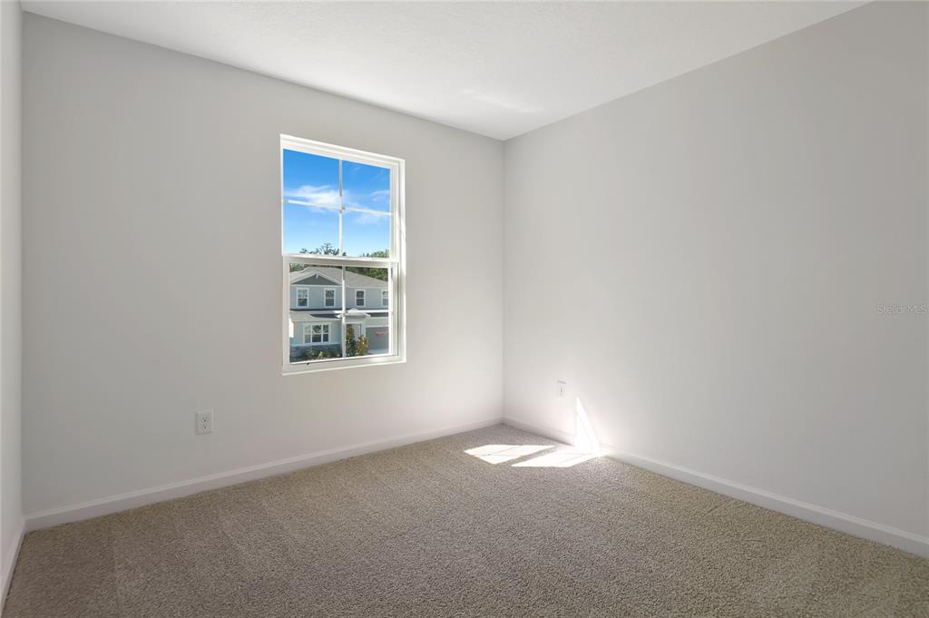 6169 Southwest 64th St Road Ocala, FL 34474 - Photo 16 of 25 an empty room with a window