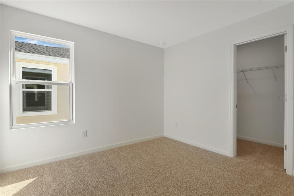 6169 Southwest 64th St Road Ocala, FL 34474 - Photo 17 of 25 a view of an empty room with a window