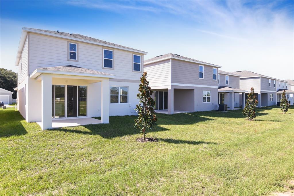 6169 Southwest 64th St Road Ocala, FL 34474 - Photo 23 of 25 a view of a house with a yard