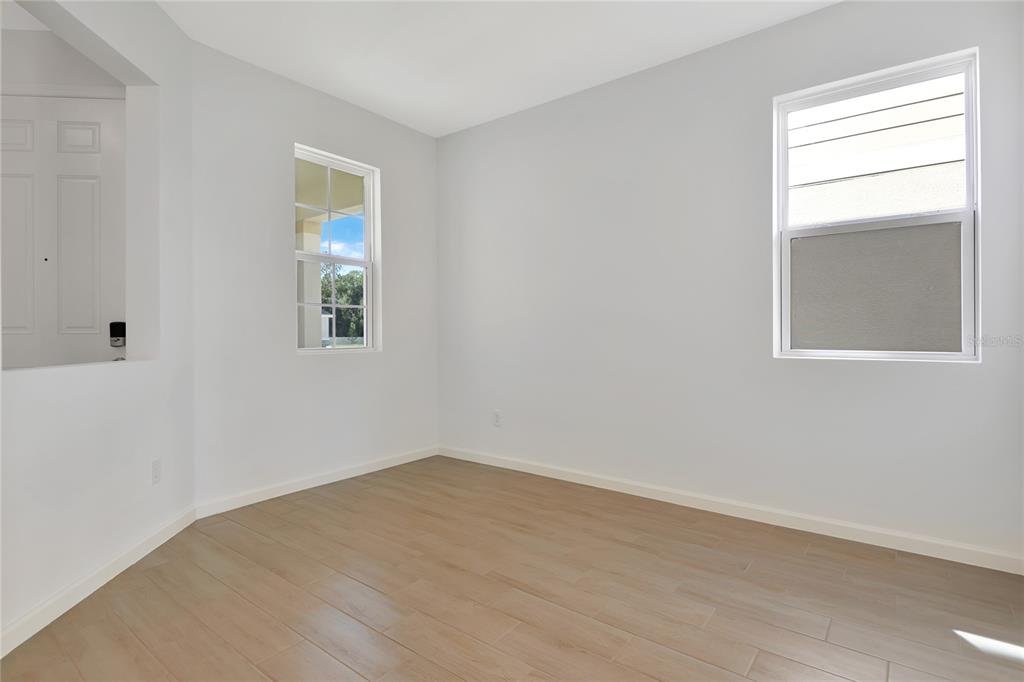 6169 Southwest 64th St Road Ocala, FL 34474 - Photo 5 of 25 an empty room with a window