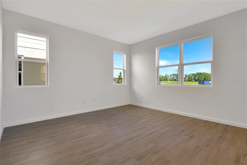 6169 Southwest 64th St Road Ocala, FL 34474 - Photo 10 of 25 an empty room with a window