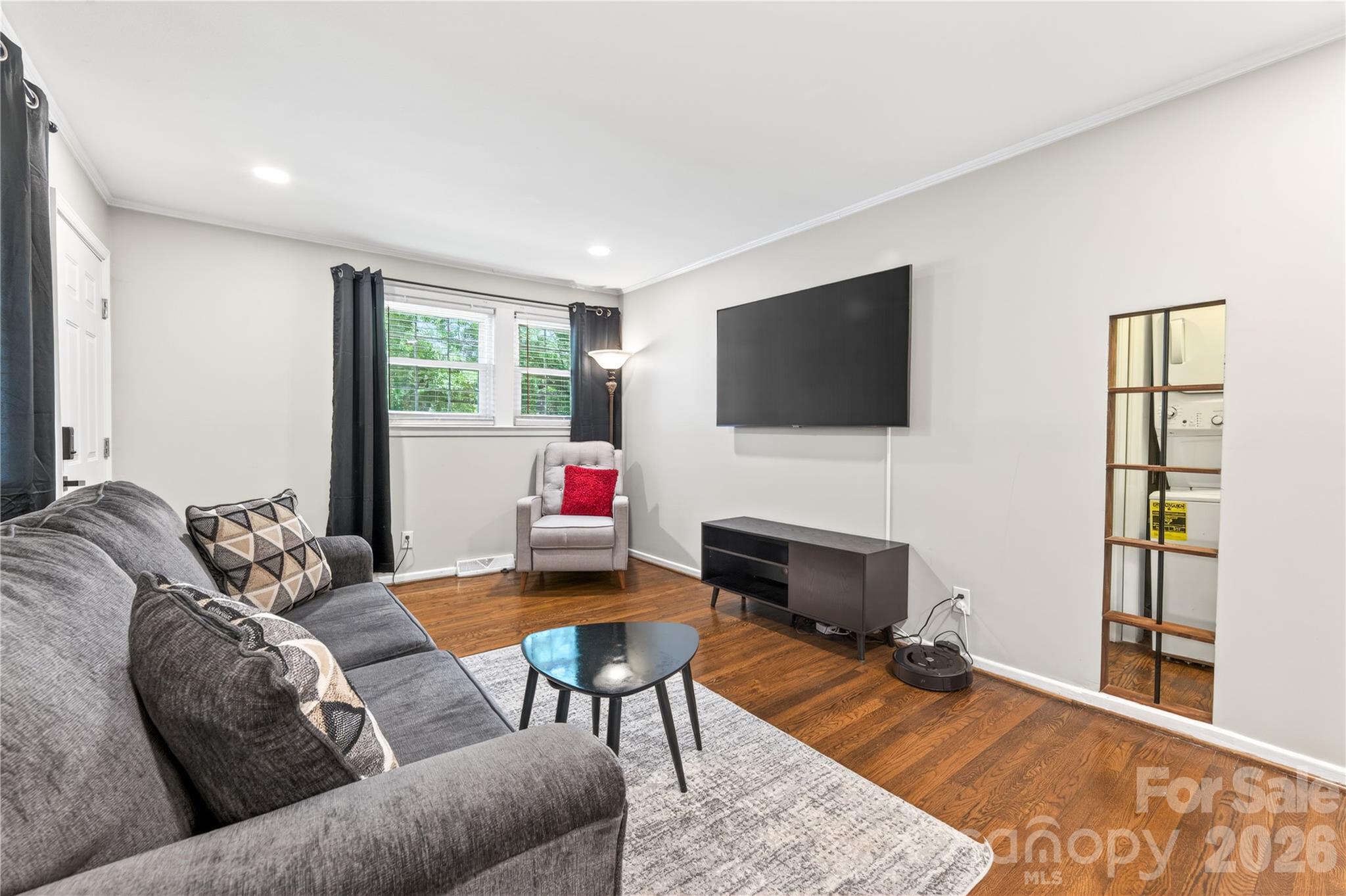 3241 Minnesota Road Charlotte, NC 28208 - Photo 6 of 18 a living room with furniture and a flat screen tv