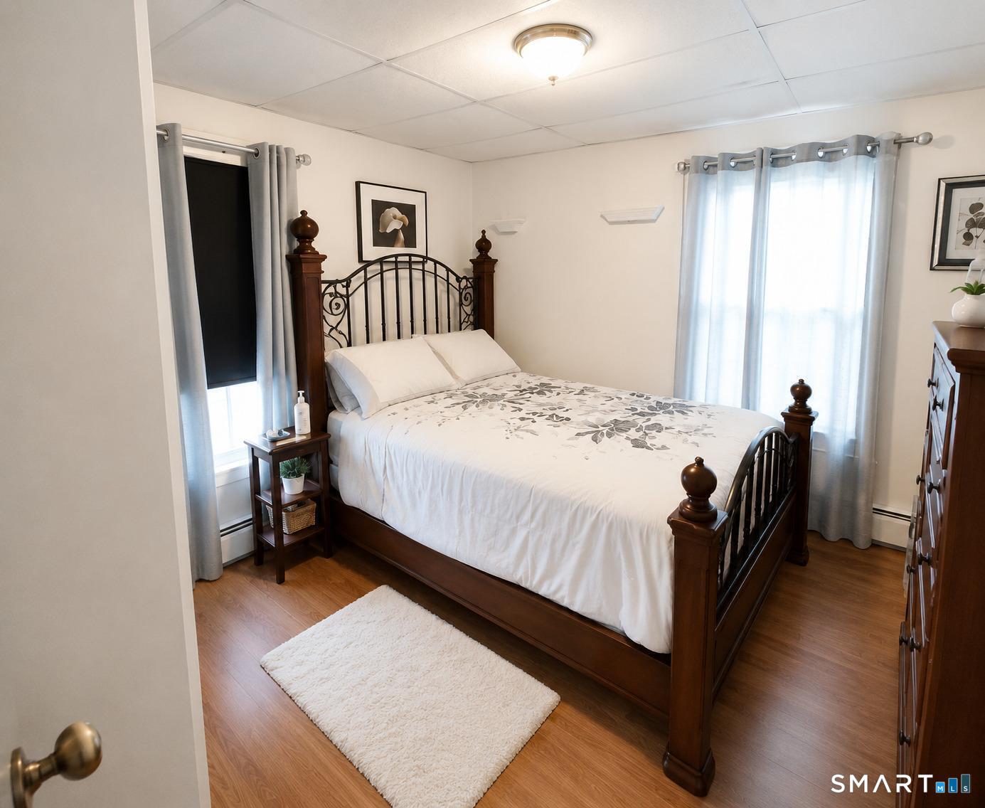 61 Bartlett Street Meriden, CT 06451 - Photo 25 of 30 a bedroom with a bed and a window