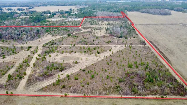 a view of a dry mountains with green field