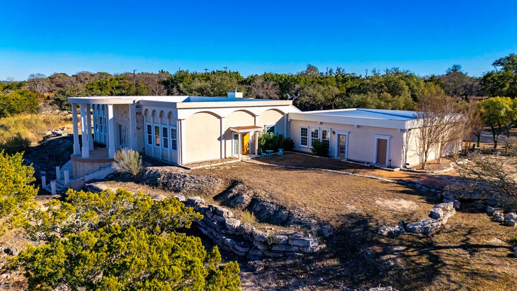 157 McCullough Ranch Road Kerrville, TX 78028 - Photo 11 of 75 a view of a house with a yard and mountain view