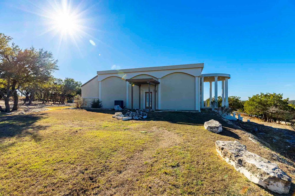 157 McCullough Ranch Road Kerrville, TX 78028 - Photo 14 of 75 a view of a house with a yard