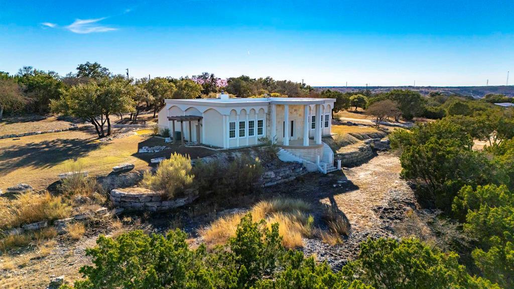 157 McCullough Ranch Road Kerrville, TX 78028 - Photo 3 of 75 a view of a house with a yard