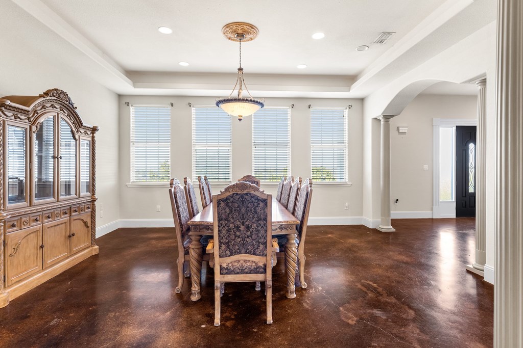 157 McCullough Ranch Road Kerrville, TX 78028 - Photo 35 of 75 a view of a a dining room with furniture window and wooden floor