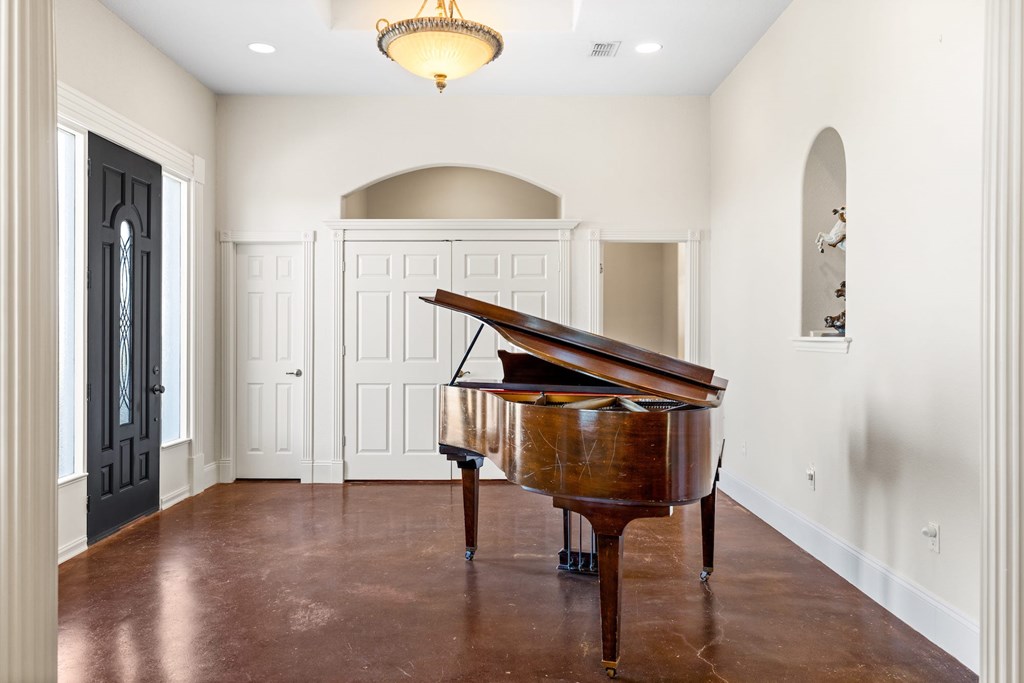 157 McCullough Ranch Road Kerrville, TX 78028 - Photo 37 of 75 a view of entryway and hall with wooden floor