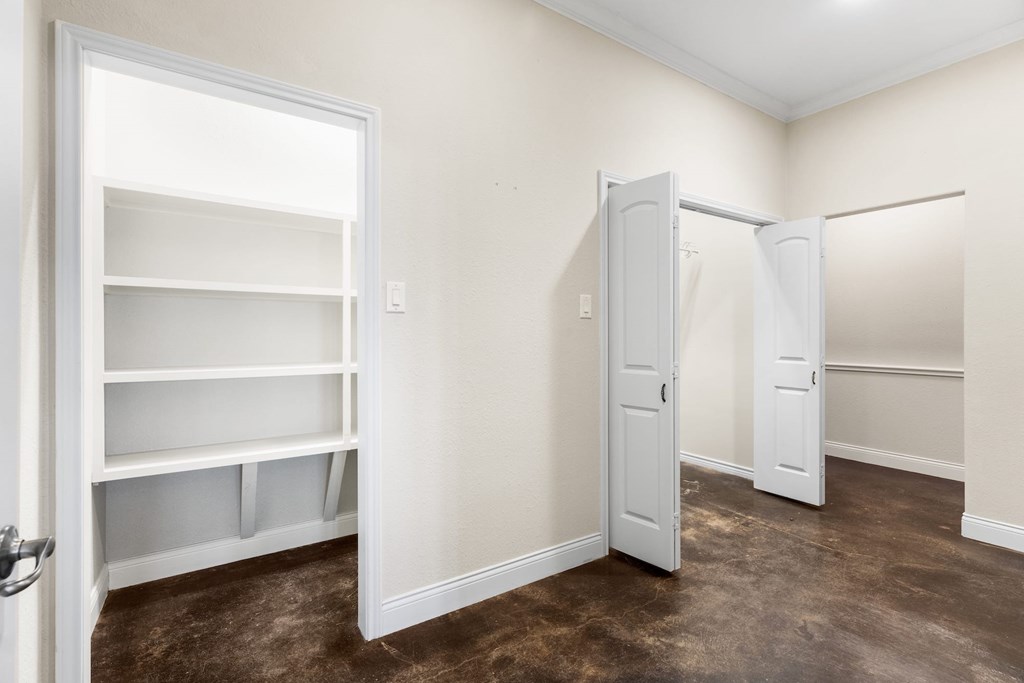 157 McCullough Ranch Road Kerrville, TX 78028 - Photo 47 of 75 a view of walk in closet with empty racks