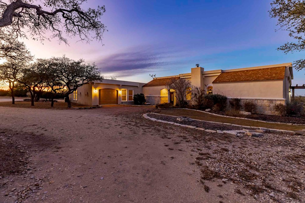 157 McCullough Ranch Road Kerrville, TX 78028 - Photo 64 of 75 a view of a house with backyard and sitting area