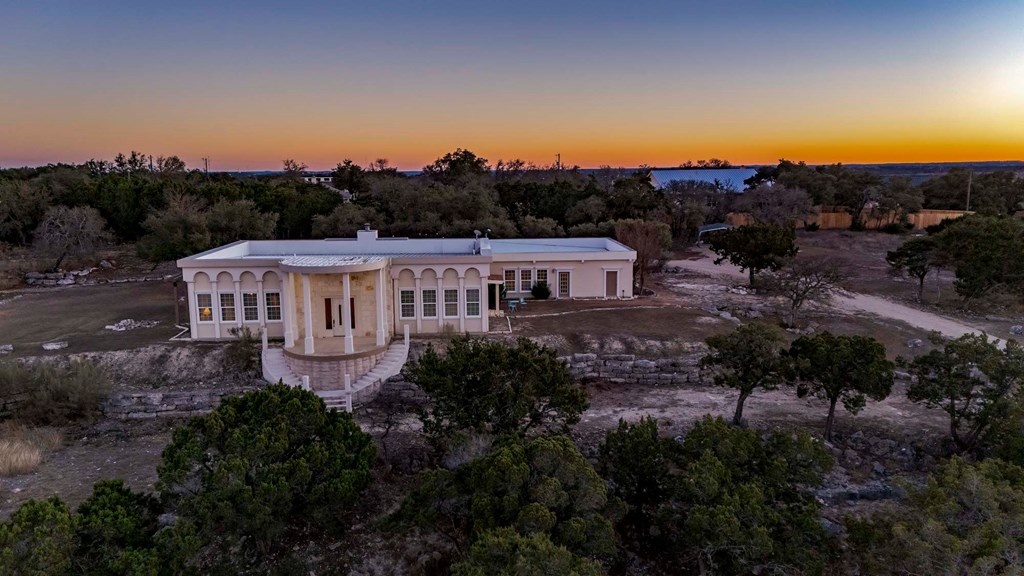 157 McCullough Ranch Road Kerrville, TX 78028 - Photo 67 of 75 a view of a house with a garden