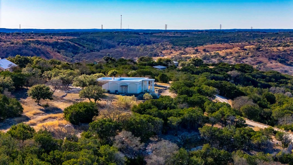 157 McCullough Ranch Road Kerrville, TX 78028 - Photo 9 of 75 front view of a house with a yard