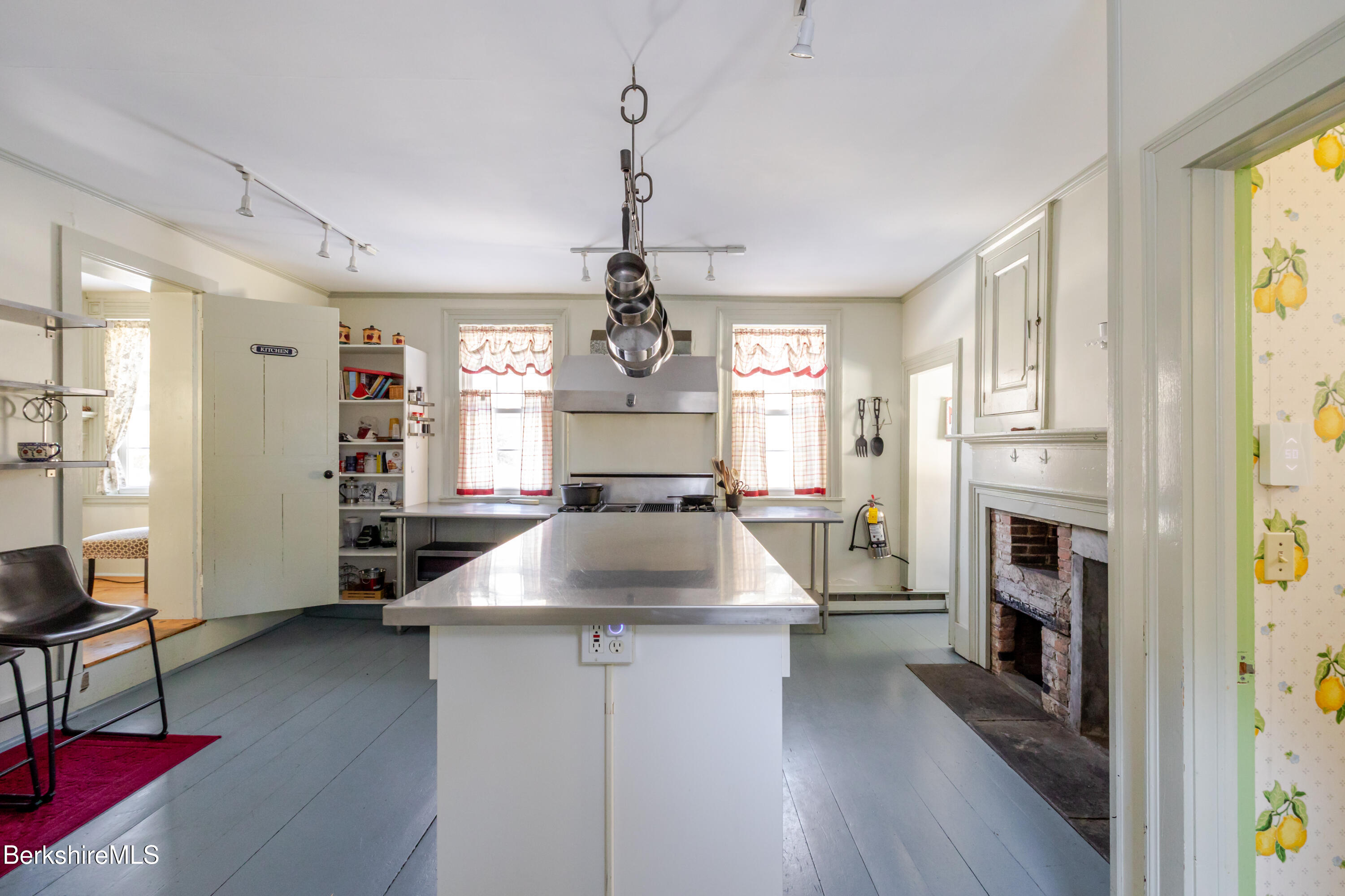 3 Lake Buel Road Great Barrington, MA 01230 - Photo 9 of 55 a kitchen with stainless steel appliances granite countertop a refrigerator oven a sink dishwasher and a fireplace with wooden floor